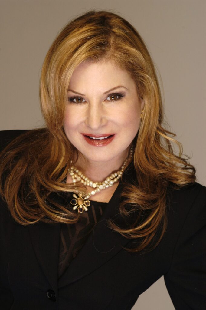 Author Cat Green wearing a black outfit